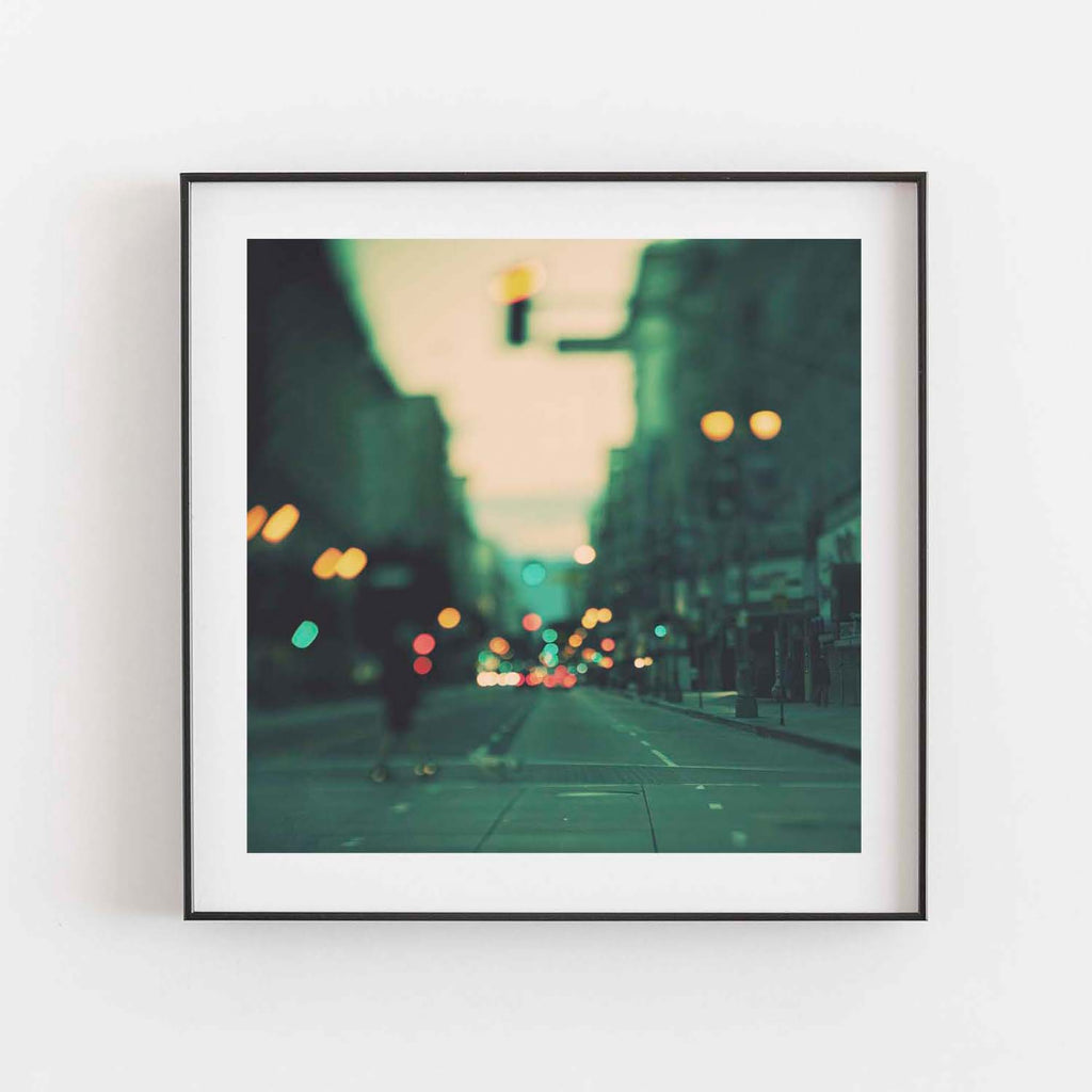 Abstract photo of downtown Los Angeles. with a green background and colorful bokeh lights.