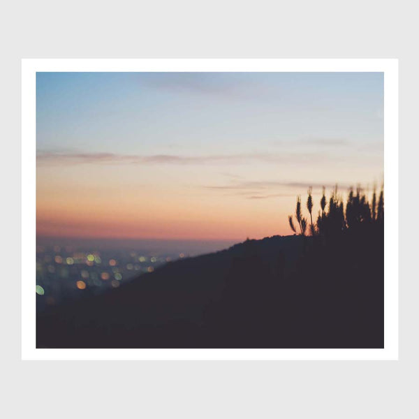 Sunset bokeh photograph of LA. Dreamy cityscape art print with a canyon silhouette.