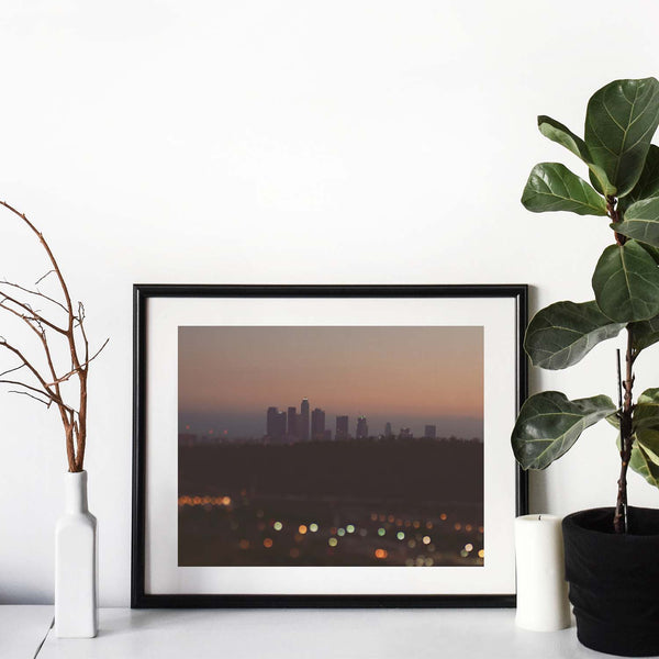 Framed print of the Los Angeles skyline at night . With Bokeh lights.